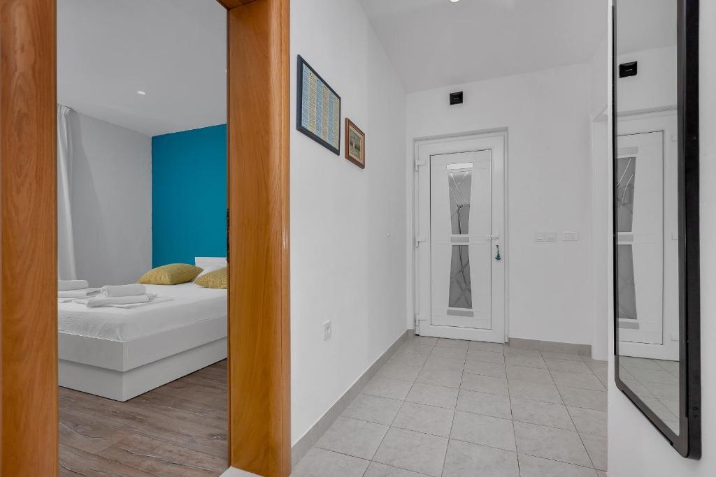 Postel nebo postele na pokoji v ubytování Blue Dream Apartment