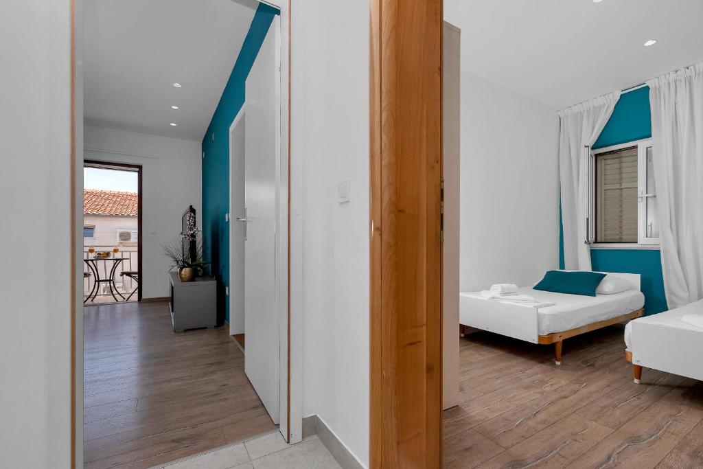 Postel nebo postele na pokoji v ubytování Blue Dream Apartment