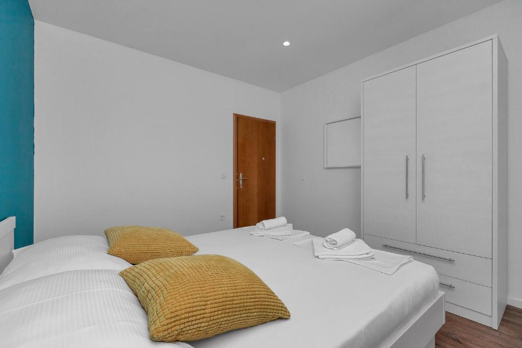 Postel nebo postele na pokoji v ubytování Blue Dream Apartment