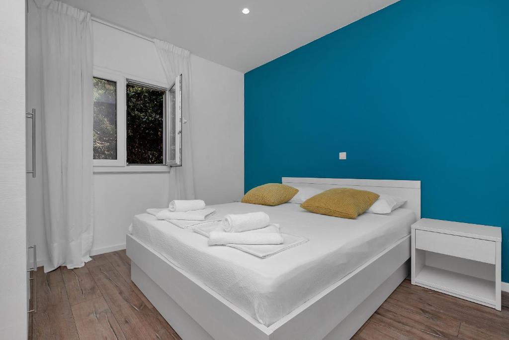 Postel nebo postele na pokoji v ubytování Blue Dream Apartment