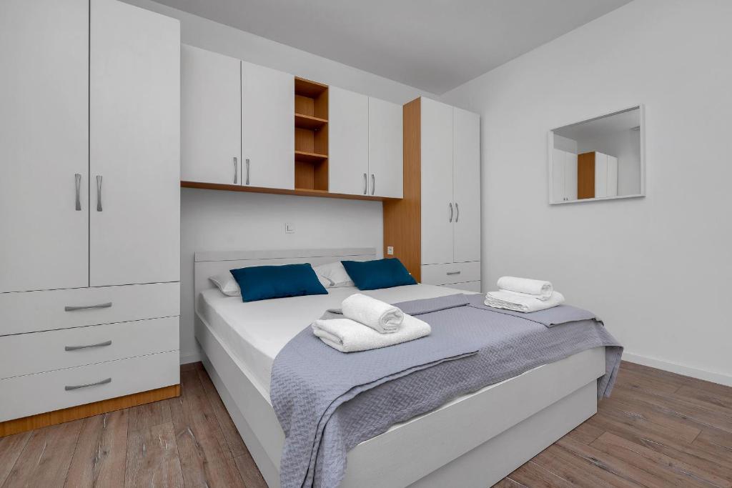 Postel nebo postele na pokoji v ubytování Blue Dream Apartment