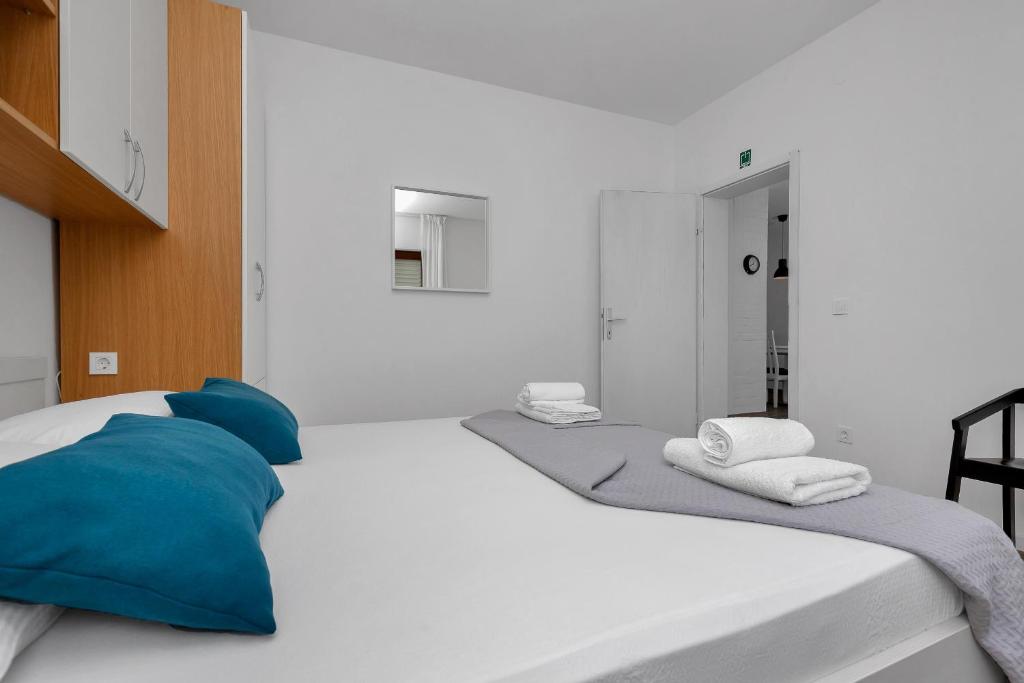 Postel nebo postele na pokoji v ubytování Blue Dream Apartment