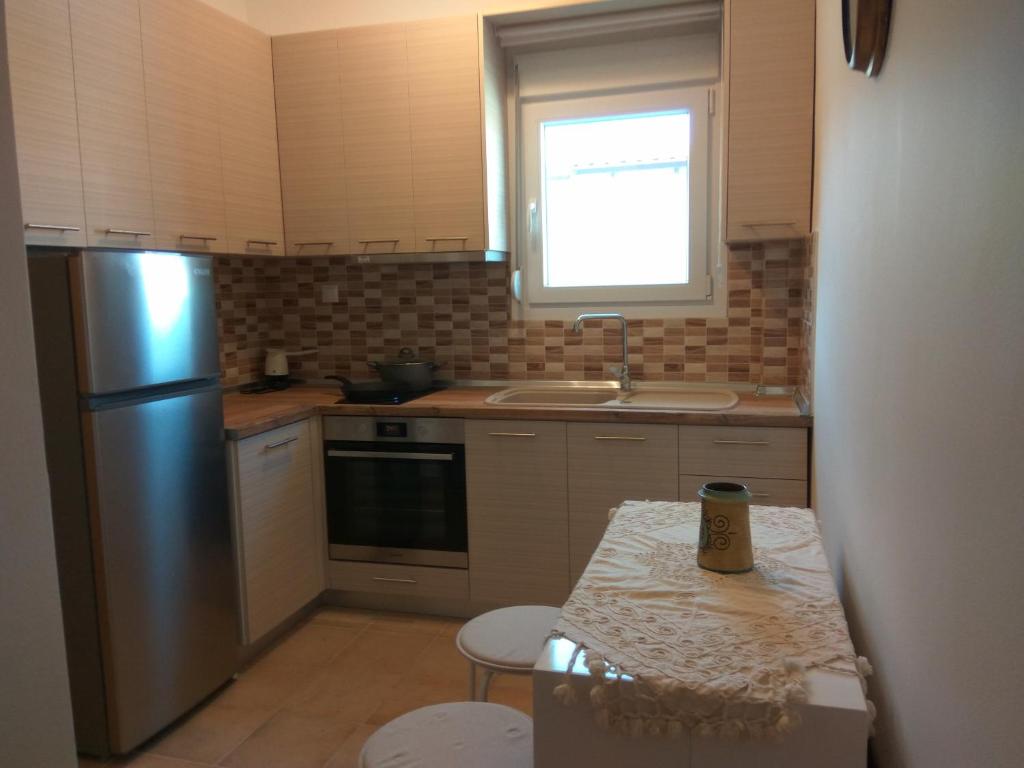 Kuchyň nebo kuchyňský kout v ubytování Eirini's Place