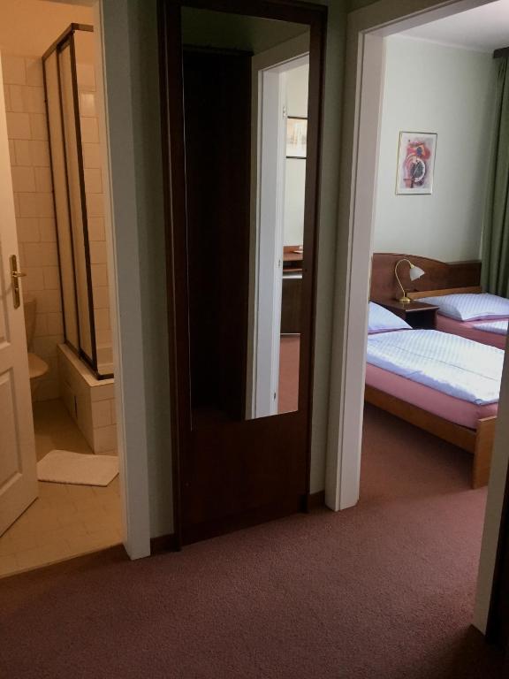 Postel nebo postele na pokoji v ubytování Hotel-Pension KAMÝK