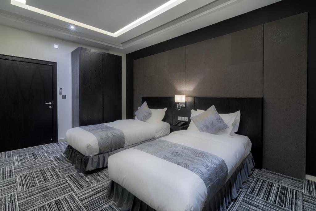 Postel nebo postele na pokoji v ubytování South Hotel Suites