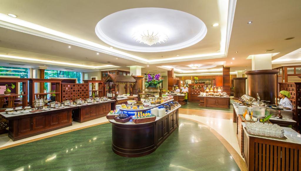 a restaurant with a buffet line in a building at Borei Angkor Resort & Spa in Siem Reap