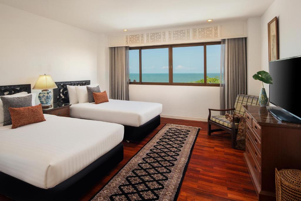Postel nebo postele na pokoji v ubytování Anantara Hua Hin Resort