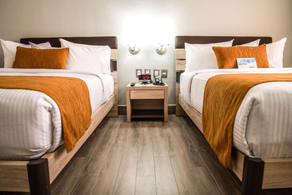 Postel nebo postele na pokoji v ubytování Comfort Inn Irapuato