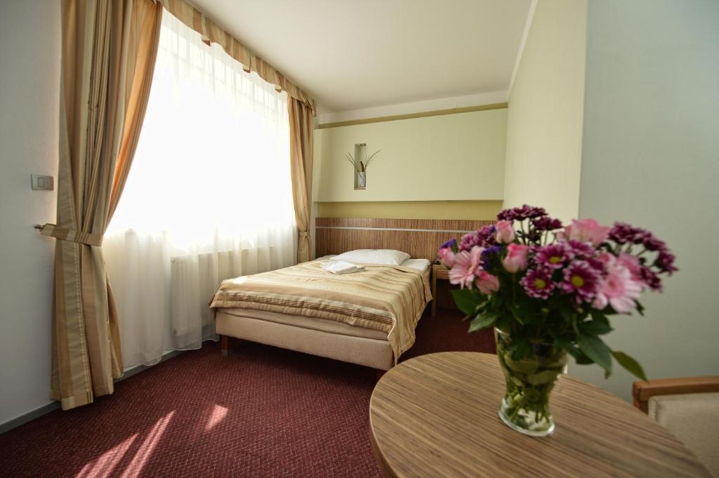 Postel nebo postele na pokoji v ubytování Hotel Vaka