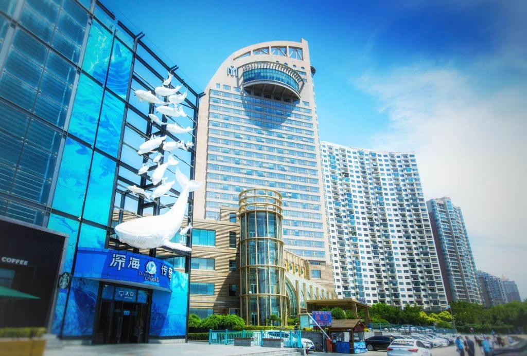 a large tall building with a lot of windows at Bayshore Hotel Dalian in Dalian