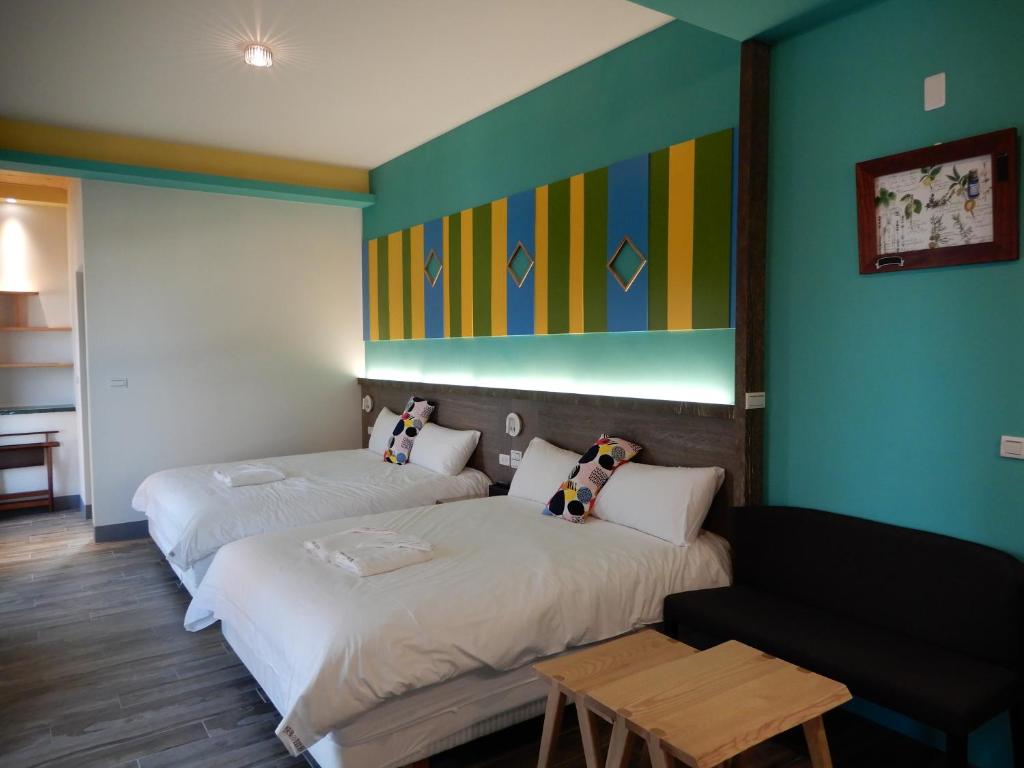 Postel nebo postele na pokoji v ubytování Happy Wing Guesthouse