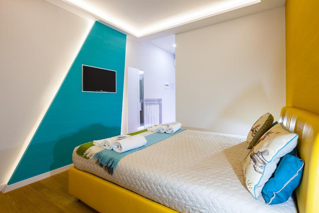 Postel nebo postele na pokoji v ubytování A Suites