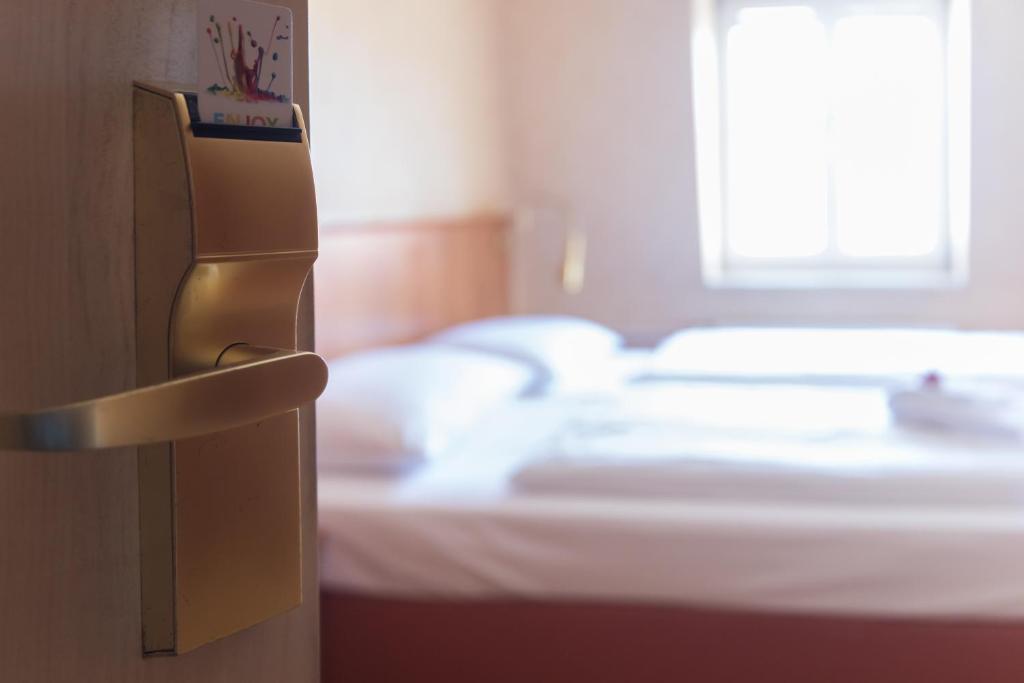 Postel nebo postele na pokoji v ubytování martas Hotel Albrechtshof Berlin