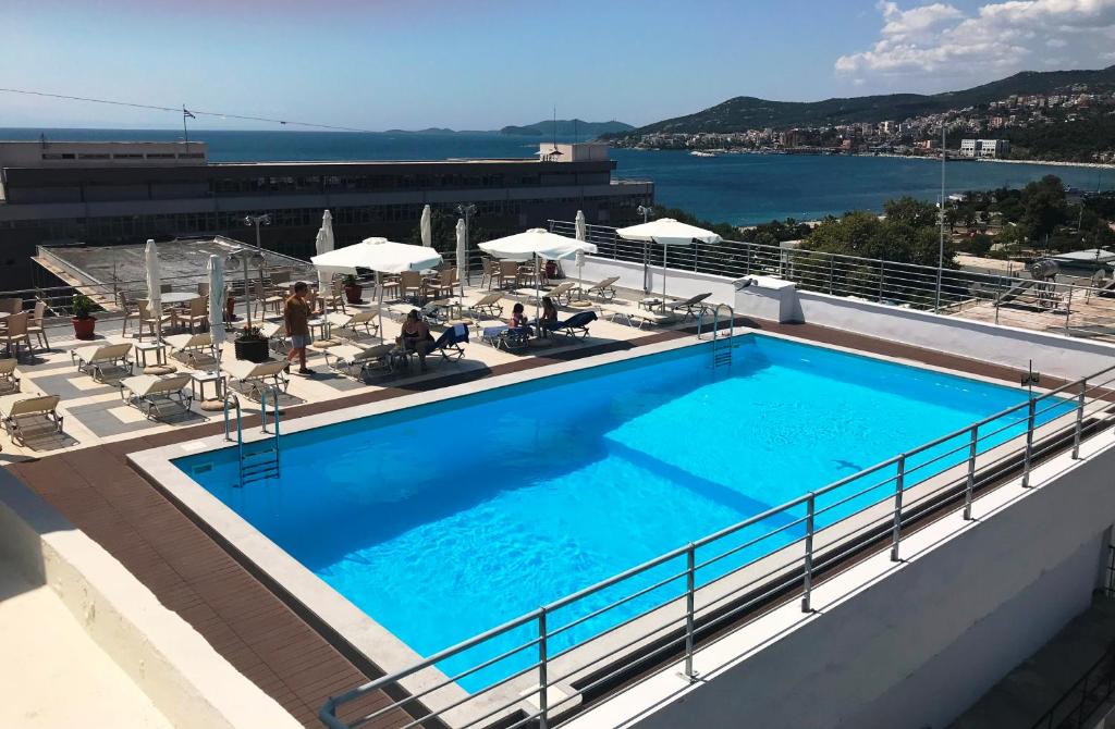 a large swimming pool on the roof of a building at Oceanis Hotel in Kavála
