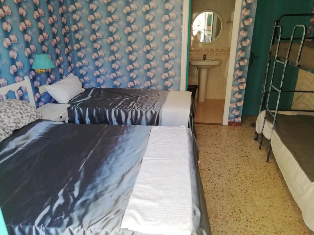 Postel nebo postele na pokoji v ubytování Can Pau Guesthouse
