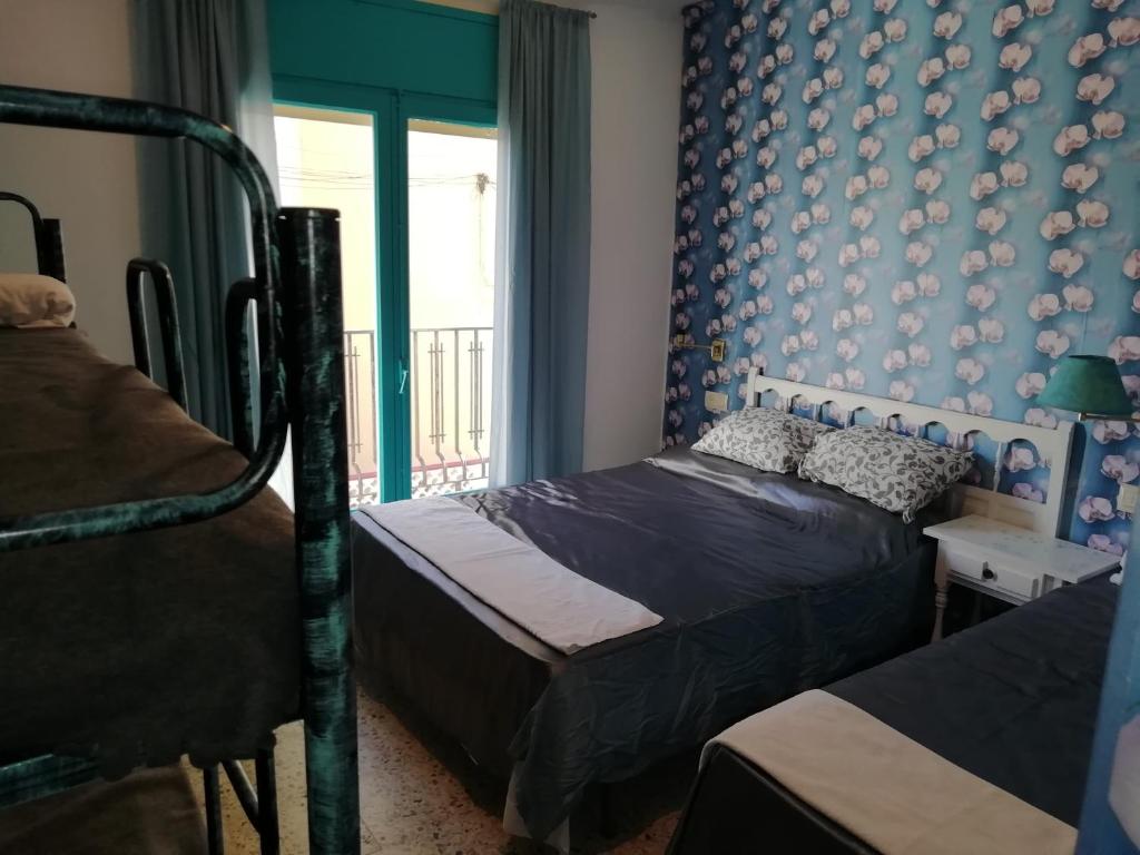 Postel nebo postele na pokoji v ubytování Can Pau Guesthouse