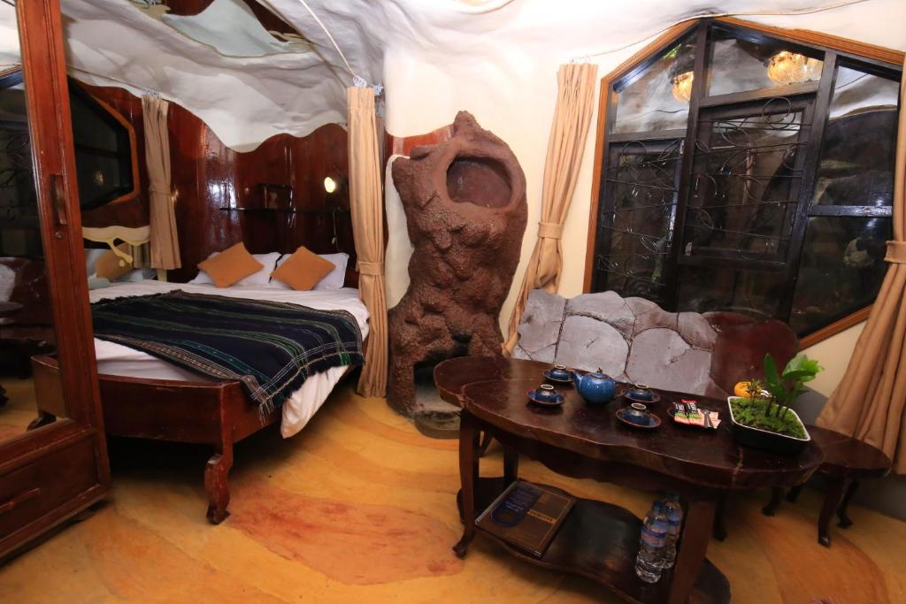 Postel nebo postele na pokoji v ubytování Crazy House