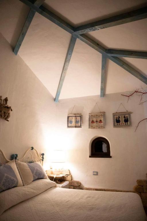 Postel nebo postele na pokoji v ubytování Rooms Romangia