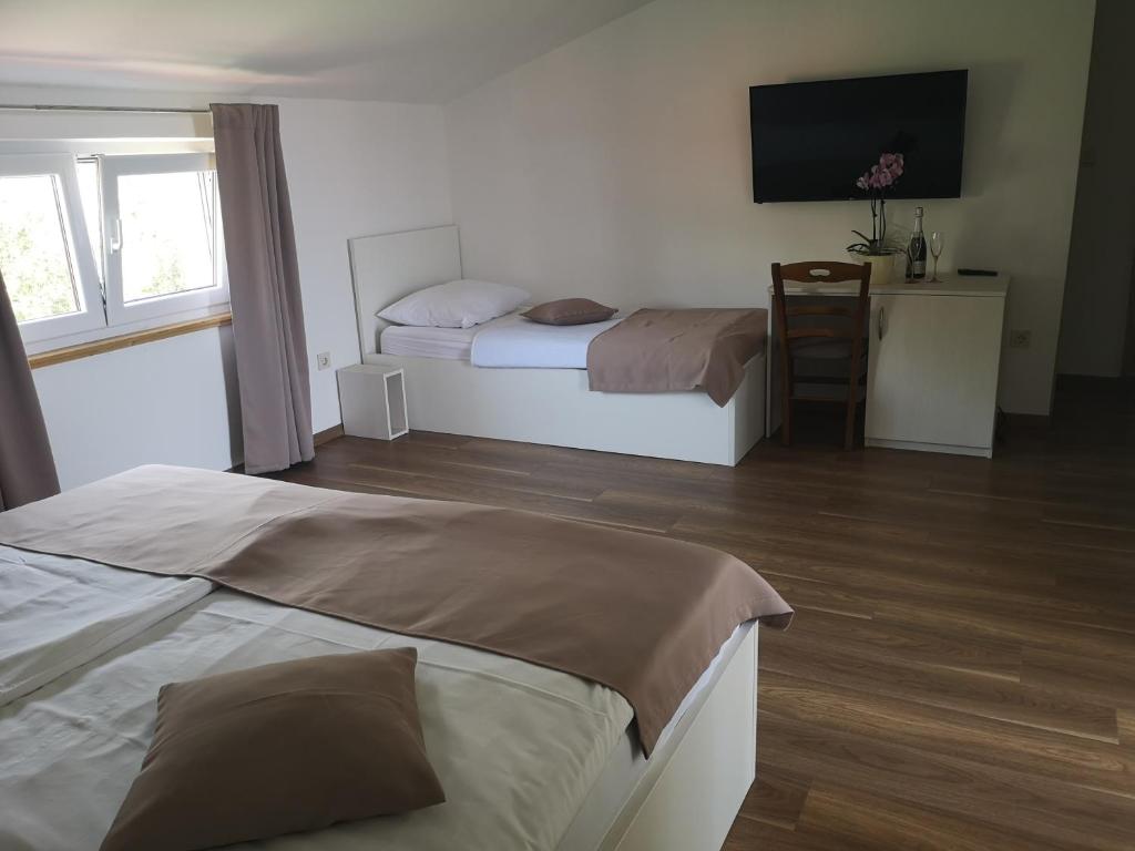 Postel nebo postele na pokoji v ubytování Rooms Vukušić