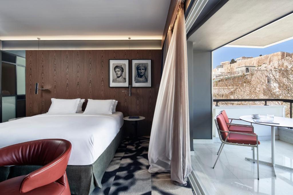 Ένα ή περισσότερα κρεβάτια σε δωμάτιο στο AthensWas Design Hotel