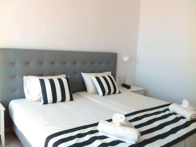 Postel nebo postele na pokoji v ubytování Hotel Akti Ouranoupoli Beach Resort