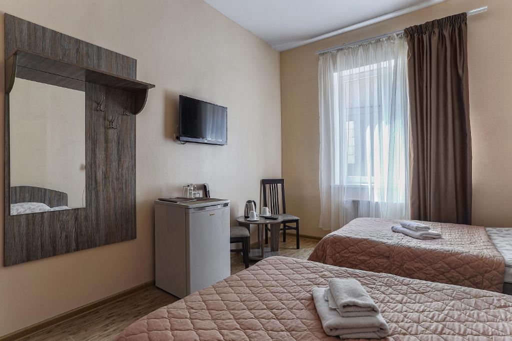 Postel nebo postele na pokoji v ubytování Arnautskiy Hotel