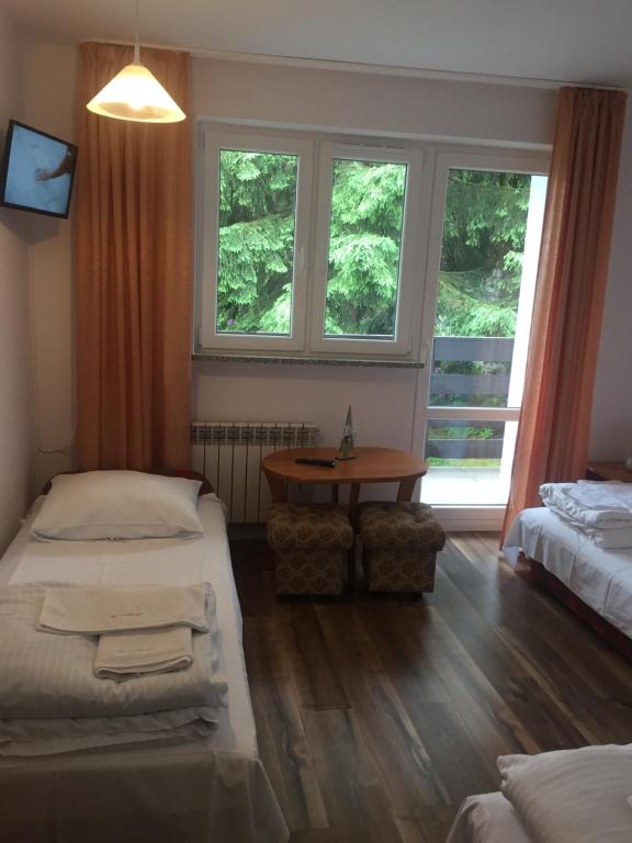 Postel nebo postele na pokoji v ubytování Willa MARANT