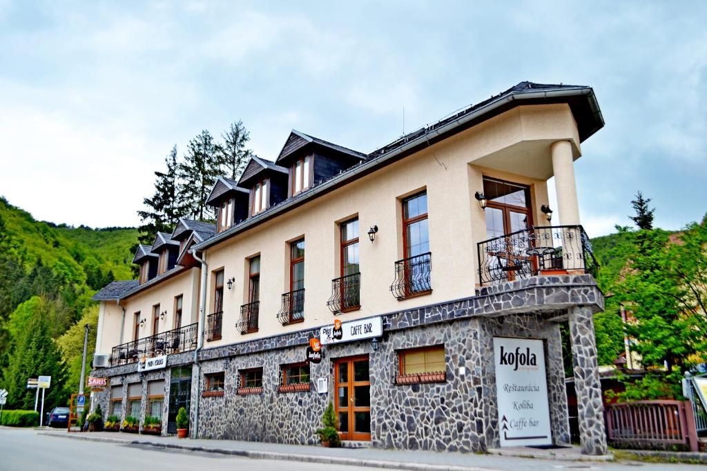 a large building on the side of a street at Penzion Daniela in Rajecké Teplice