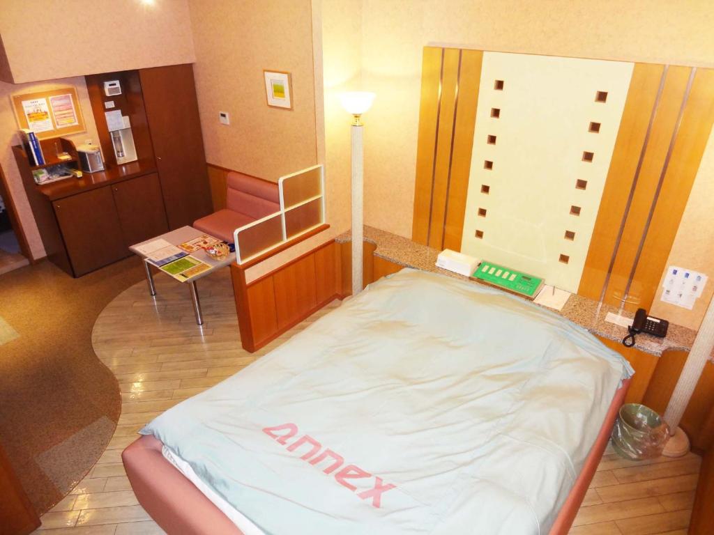 Postel nebo postele na pokoji v ubytování アネックスたまゆ 大人専用