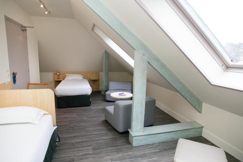 Postel nebo postele na pokoji v ubytování Hôtel Vert