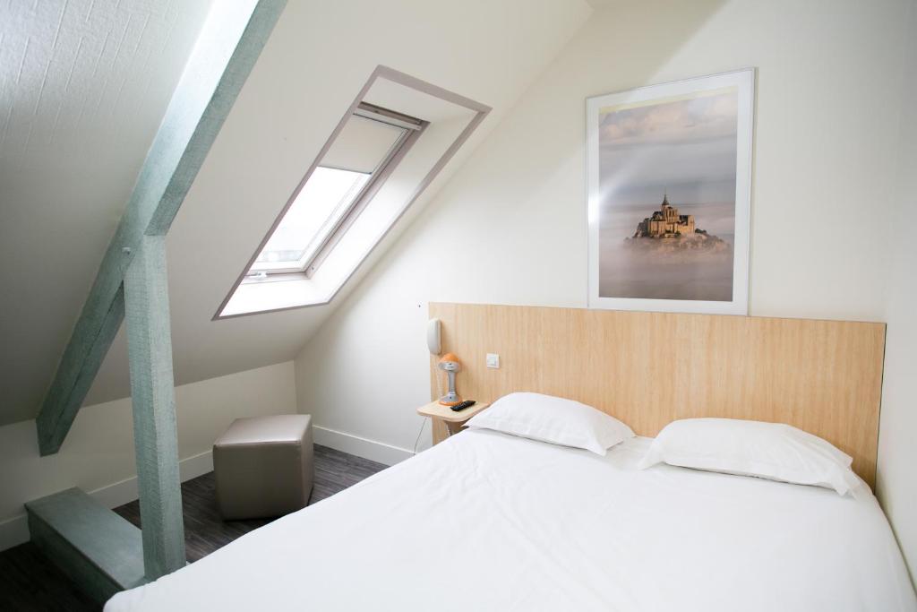 Postel nebo postele na pokoji v ubytování Hôtel Vert