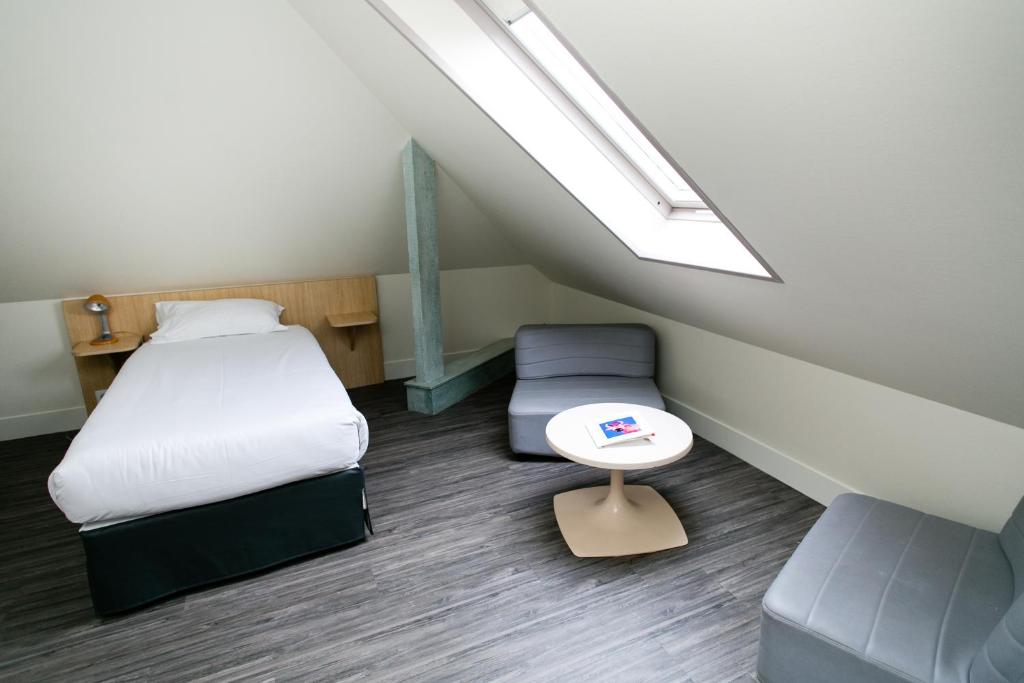 Postel nebo postele na pokoji v ubytování Hôtel Vert