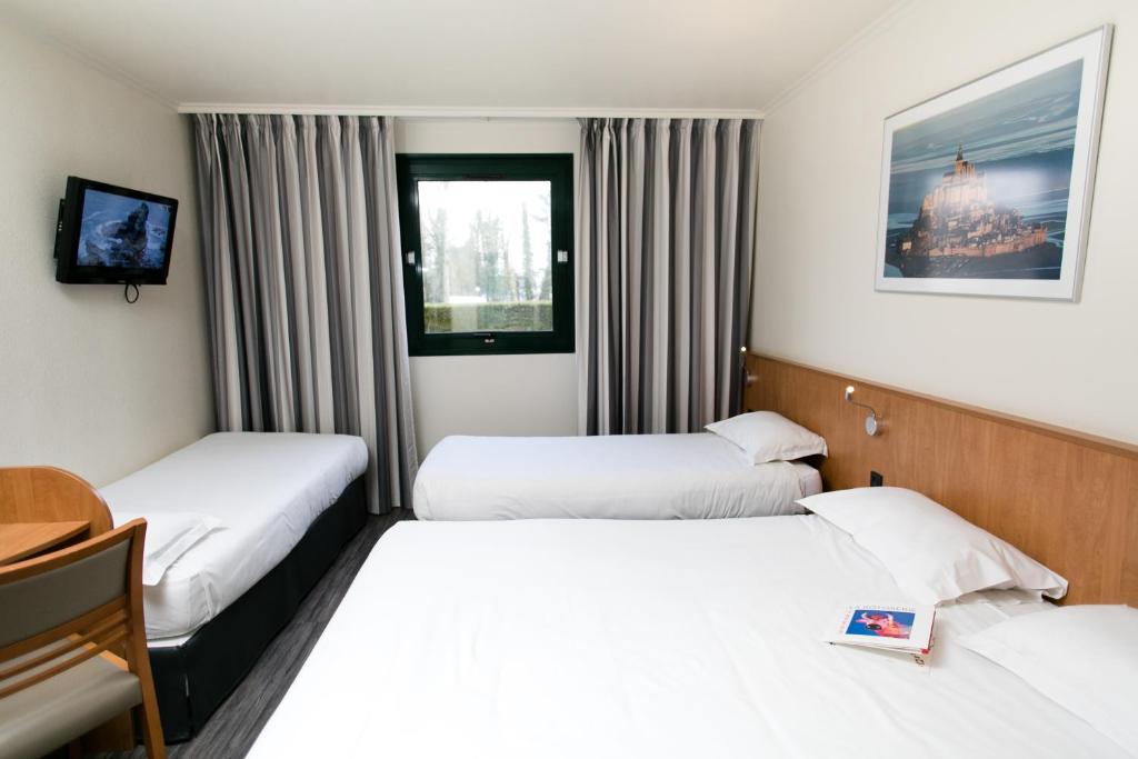 Postel nebo postele na pokoji v ubytování Hôtel Vert
