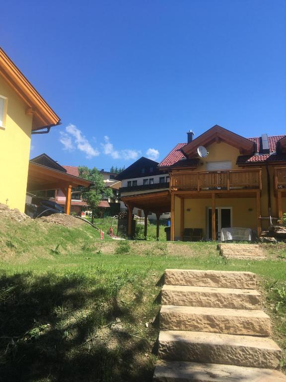 a house with some stairs in front of it at KWO-villa Sonnenglück in Arnoldstein