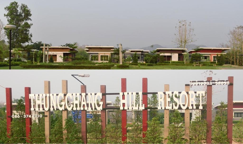 a sign on a fence in front of a house at Thungchanghill Resort in Nan