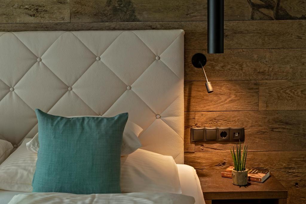 Postel nebo postele na pokoji v ubytování Hotel Stern