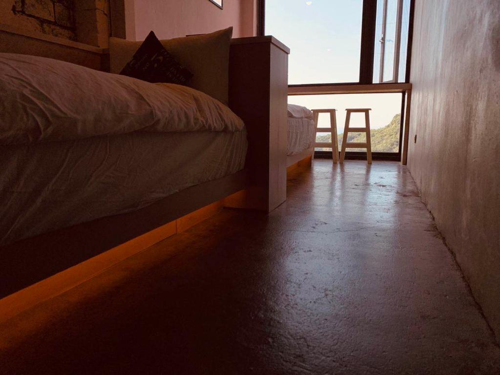 Postel nebo postele na pokoji v ubytování M Bar House