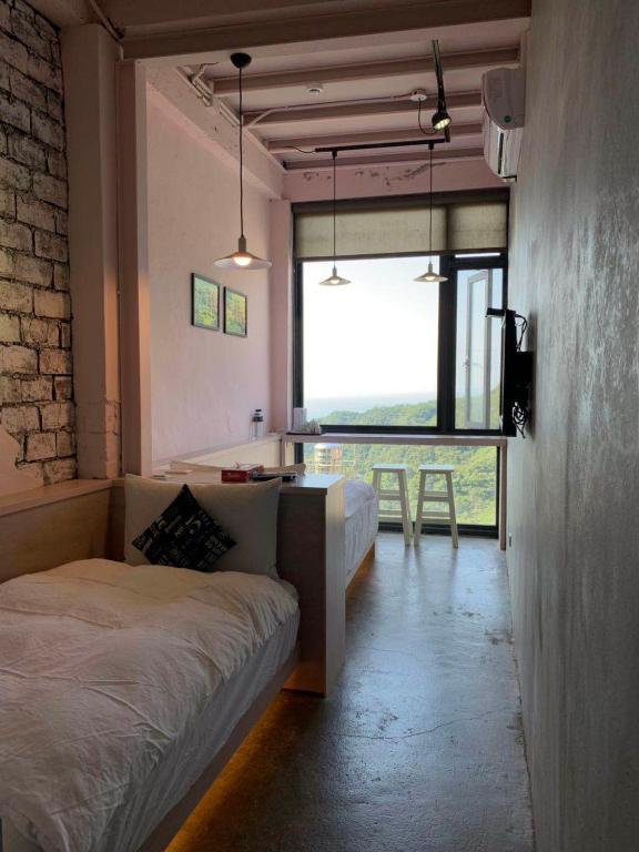 Postel nebo postele na pokoji v ubytování M Bar House