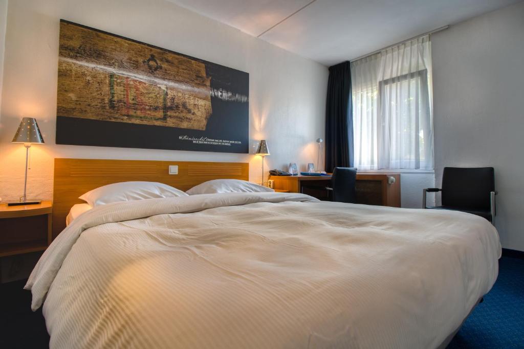 Postel nebo postele na pokoji v ubytování Fletcher Resort-Hotel Zutphen