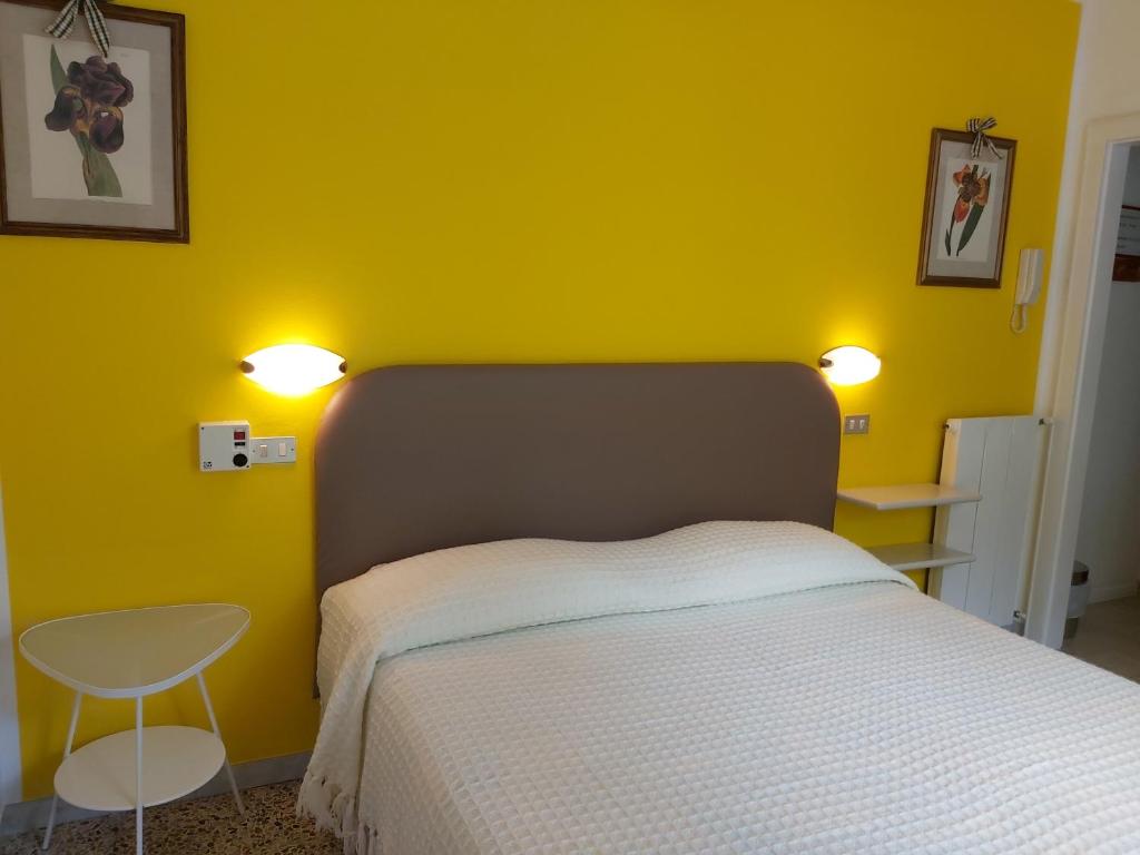 Postel nebo postele na pokoji v ubytování Hotel Casa Popi
