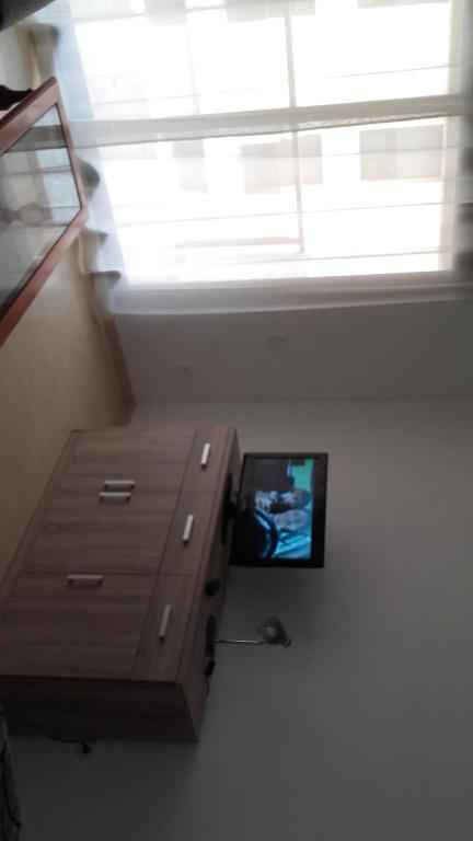 Televízia a/alebo spoločenská miestnosť v ubytovaní Apartamento 3 Hab. en el Parador