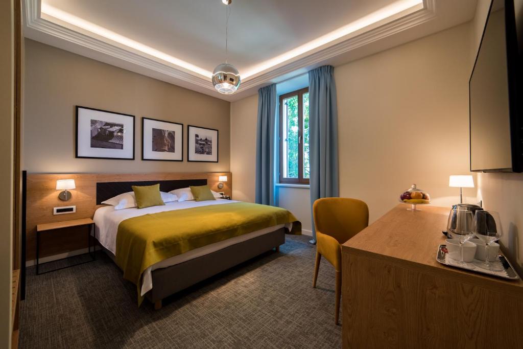 Postel nebo postele na pokoji v ubytování Boutique Villa Filaus