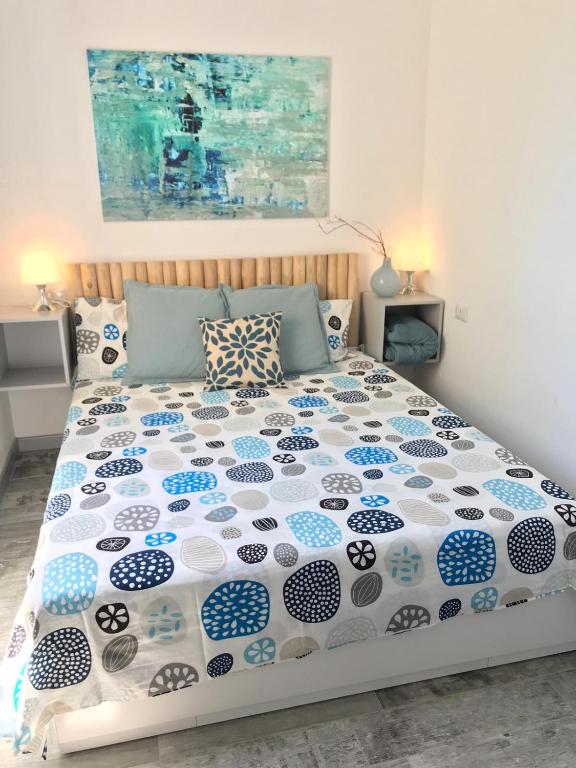 A bed or beds in a room at Villa nel villaggio Costa Caddu San Teodoro