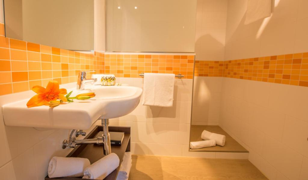 Ванная комната в Aparthotel Ona Aucanada