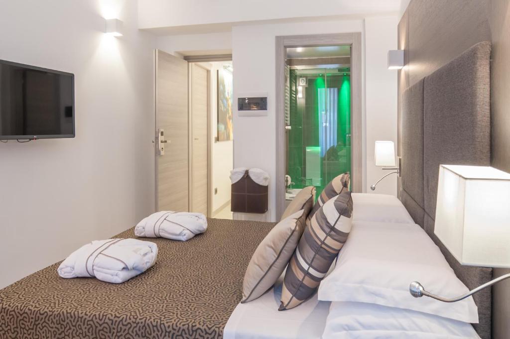Posteľ alebo postele v izbe v ubytovaní Wellness Home Rome