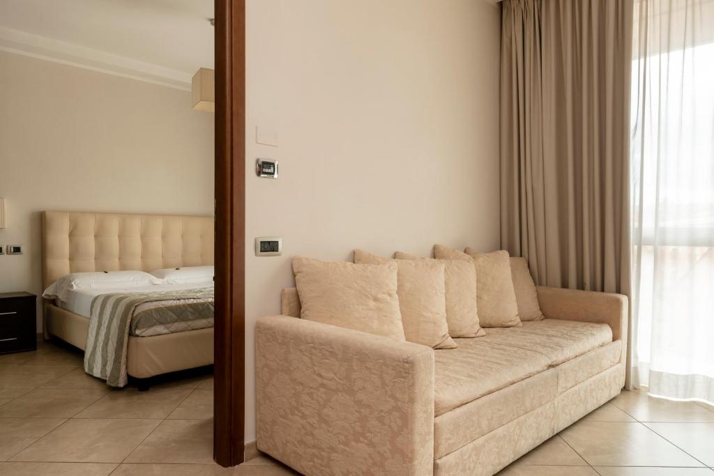 Postel nebo postele na pokoji v ubytování ApartHotel Anghel