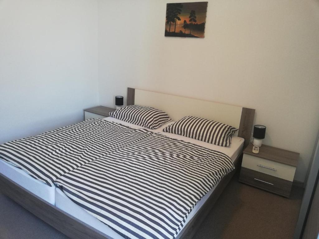 A bed or beds in a room at Stole Apartment