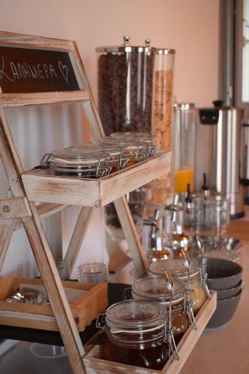 a shelf filled with plates and pans on a counter at Belvedere in Livadi