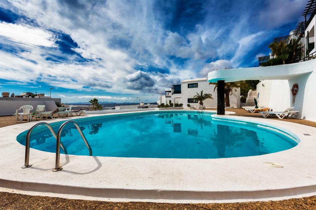 The swimming pool at or close to Gin Gin Vivienda Vacacional