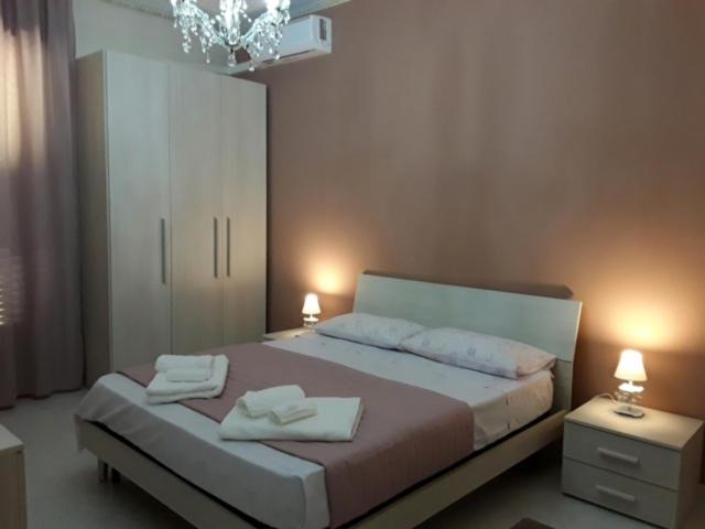 En eller flere senge i et værelse på B&B La Giara